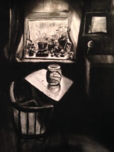 A charcoal picture by Martine Ormerod showing the inside of a house with a chair by a table