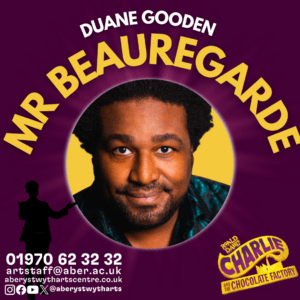 Duane Gooden is Mr Beauregarde, a man in front of yellow and purple background